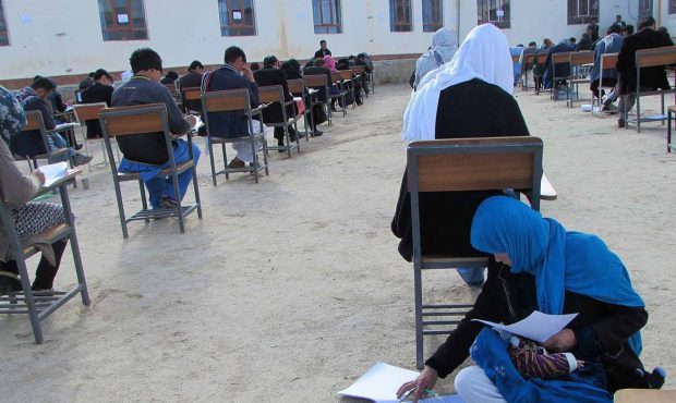 Jahan Taab, 25, taking Kankor exam in in Afghanistan's Daykundi province....