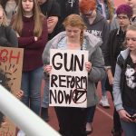 Some of the students held signs calling for gun reform.