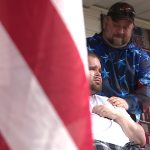 Stan Summers and his son Talan as soldiers arrive at their Tremonton home to recognize Talan.