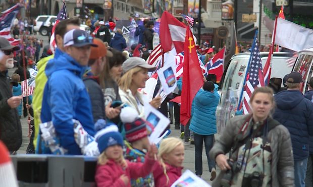 Thousands of people stood on both sides of Main Street to cheer and say congratulations....
