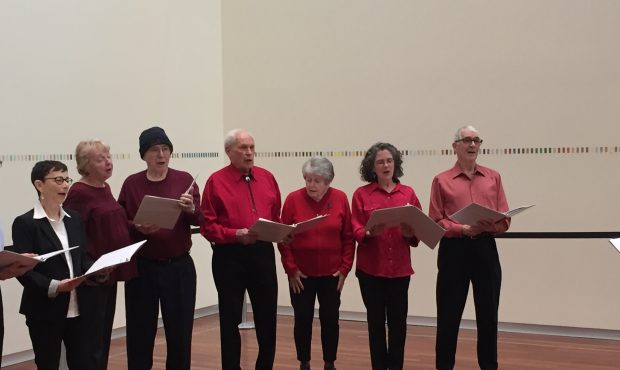 Dick and Jean Raybould, center, sing at their first performance with a special choir for dementia p...