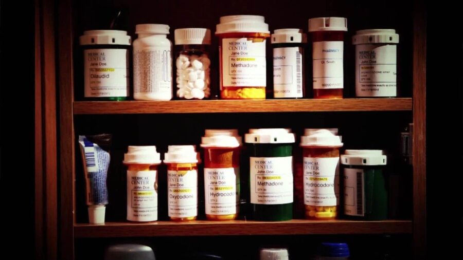 (FILE) Opioids and other medications in a medicien cabinet....