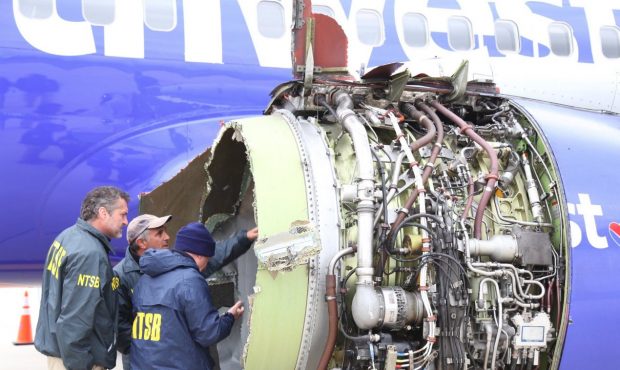 The National Transportation Safety Board is onsite inspecting a Southwest airline plane after engin...