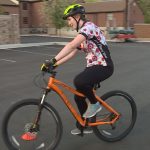 Tesla Harbaugh practices riding her bike on one of the courses the instructor set up. Source - KSL TV

