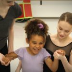 Ballet West dancers work with Grace, a student in the Movement Mentor program.