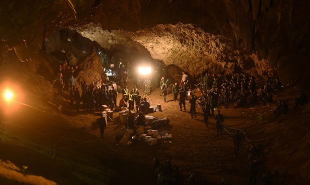 Thai soldiers relay electric cable deep into the Tham Luang cave at the Khun Nam Nang Non Forest Pa...