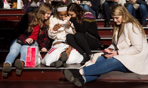 FILE: Teens have always ignored their parents. These days they do it while staring into a smartphon...