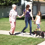 Lydia Ruttenbur's daughters take Peggy for a walk around the neighborhood to get some fresh air.