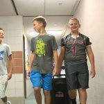 From left: Sixth graders Braylor Hoggan, Matthew Rudman, and Cade Draper walk the halls to collect recyclable paper products from classrooms at Country View Elementary.