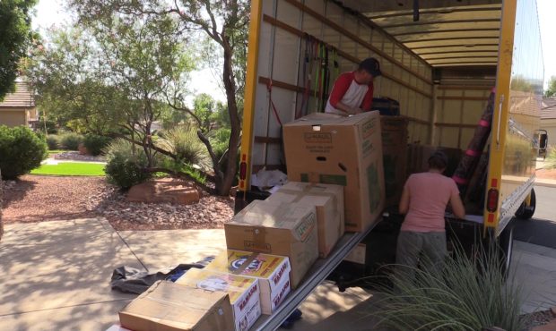 Movers unload a truck in St. George, UT....