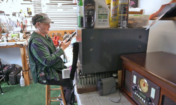Windy Shaffer attempts to ascertain the problems with an oboe in her Spanish Fork shop.  (October 9...