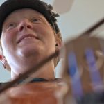 Windy Shaffer demonstrates her cello skills in her Spanish Fork shop.  (October 9, 2018)