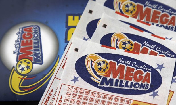 FILE - This July 1, 2016, file photo shows Mega Millions lottery tickets on a counter at a Pilot tr...