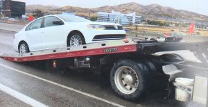 At least two dozen cars experienced flat tires Wednesday thanks to potholes on I-15.