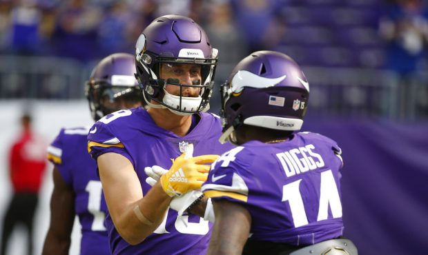 FILE - In this Sept. 23, 2018, file photo, Minnesota Vikings wide receiver Adam Thielen talks with ...