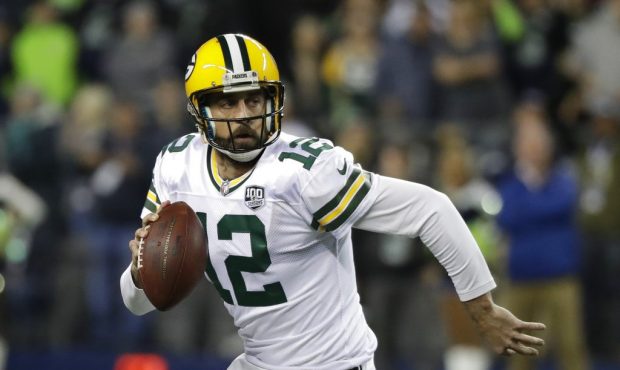 FILE - In this Nov. 15, 2018, file photo, Green Bay Packers quarterback Aaron Rodgers looks to pass...