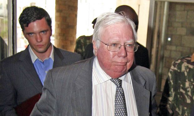 FILE - In this Oct. 7, 2008, file photo, Jerome Corsi, right, arrives at the immigration department...