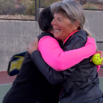 Julie Kanouse and Di Shanklin give each other a hug after a heated game of pickleball.