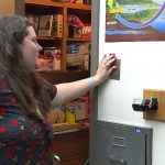 Krista Gibbons turns on the light in her classroom's food pantry. (December 11, 2018)