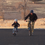 FILE: Owen Jones rides bikes outside with his dad, Jason Jones.