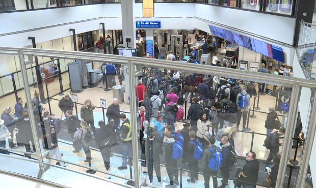 Travelers go through the TSA checkpoint in the Salt Lake City airport....