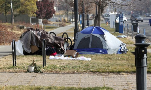 People camp in the parking strip outside The Leonardo on 400 South in Salt Lake City on Monday, Dec...