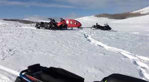 Snowmobiles sit on the island in Strawberry Reservoir after ice fishers were rescued. Photo: Wasatch County Search and Rescue