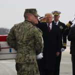 DOVER, DELAWARE - JANUARY 19: U.S. President Donald Trump salutes while joined by Secretary of State Mike Pompeo (R) as a military carry team moves the transfer case containing the remains of Scott A. Wirtz during a dignified transfer at Dover Air Force Base, January 19, 2019 in Dover, Delaware. Wirtz was a former Navy Seal who worked for the Defense Intelligence Agency and was one of four Americans killed by a suicide bomber on January 16 in Manbij, Syria.  (Photo by Mark Wilson/Getty Images)