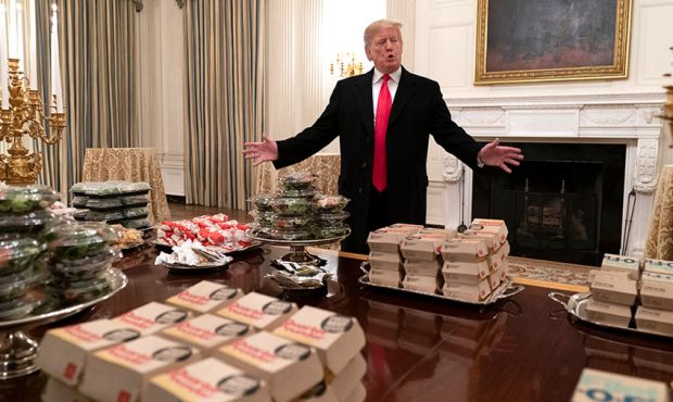 U.S President Donald Trump watches as candles are lit as he presents fast food to be served to the ...