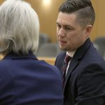 Prosecuting attorneys Spencer Walsh, right, and Barbara Lachmar talk about jury instructions during Torrey Green's rape trial, Wednesday, Jan.16, 2019 in Brigham City, Utah. Green is accused of raping multiple women while he was a football player at Utah State University. (Eli Lucero/Herald Journal via AP)