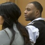 Torrey Green and his lawyer Skye Lazaro listen as the judge announces that closing arguments will be held the next day during his rape trial, Wednesday, Jan.16, 2019 in Brigham City, Utah. Green is accused of raping multiple women while he was a football player at Utah State University. (Eli Lucero/Herald Journal via AP)