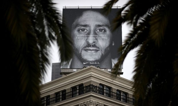 A billboard featuring former San Francisco 49ers quaterback Colin Kaepernick is displayed on the ro...