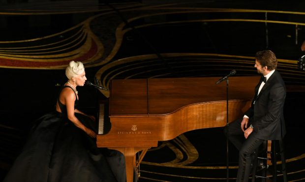 HOLLYWOOD, CALIFORNIA - FEBRUARY 24: (L-R) Lady Gaga and Bradley Cooper perform onstage during the ...