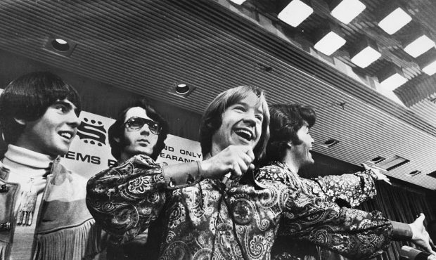 Pop band 'The Monkees', (L-R) Davy Jones, Mike Nesmith, Peter Tork and Micky Dolenz, celebrating at...