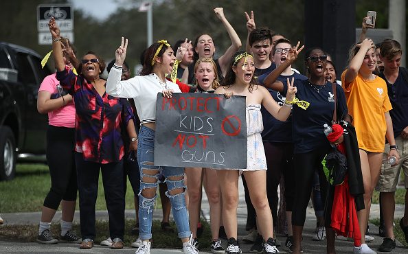 Some of the hundreds of West Boca High School students arrive at Marjory Stoneman Douglas High Scho...