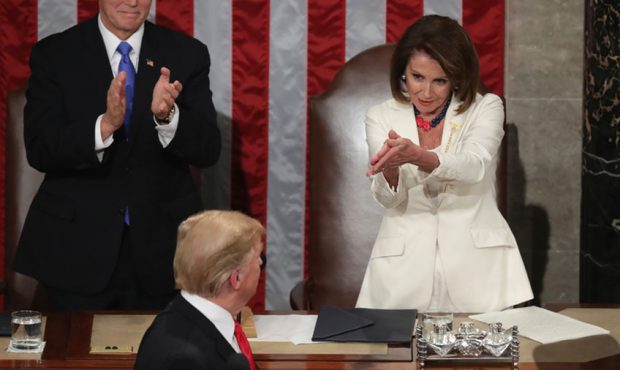 Speaker Nancy Pelosi and Vice President Mike Pence applaud President Donald Trump at the State of t...