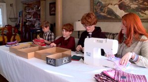  Logan Merrill has enlisted his entire family to help him sew "Just Don't" bags for his Eagle Scout project.