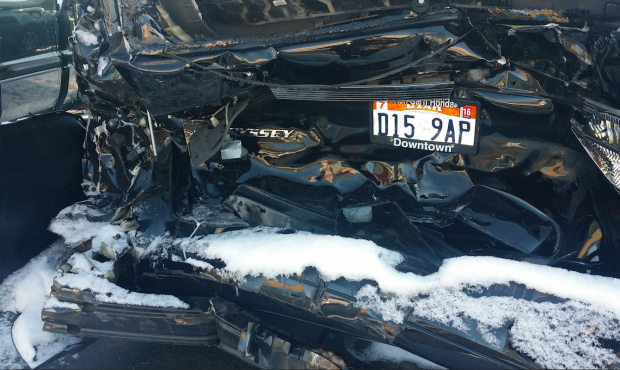 A distracted driver who was messing with his radio or CD player ran into the back of the Smith's ca...
