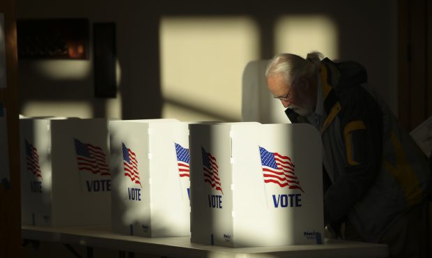 RIDGELAND, MS - NOVEMBER 27: A voter casts his ballot at a polling place at Highland Colony Baptist...
