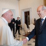 Pope Francis shakes hands with Church of Jesus Christ of Latter-day Saints President Russell M. Nelson