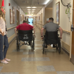 Patrick Oki and patient Terry Conley had a friendly wheelchair race down the hospital hall.