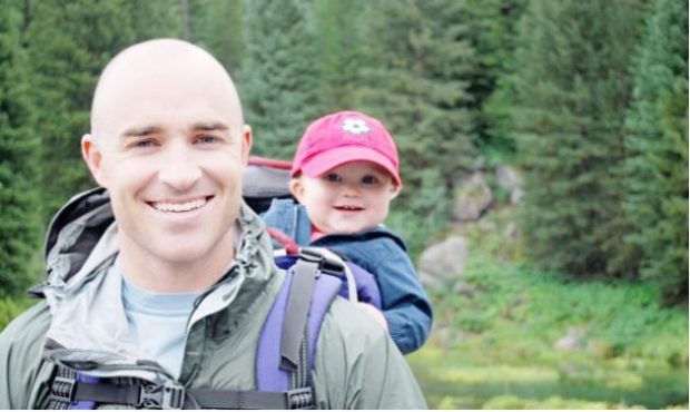 Dustin Hawkins, a former pro baseball player, is shown here hiking with his son, Bodee, in Island P...