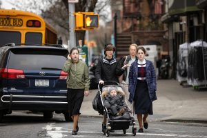 A woman pushes a stroller near the Yeshiva Kehilath Yakov School in the South Williamsburg neighborhood, April 9, 2019 in the Brooklyn borough of New York City. New York City has ordered all yeshivas in a heavily Orthodox Jewish section of Brooklyn to exclude from classes all students who aren't vaccinated against measles or face fines or possible closure. The order comes amid a recent outbreak of over 285 measles cases in Brooklyn and Queens, most of which have been concentrated in the Orthodox Jewish communities. (Photo by Drew Angerer/Getty Images)