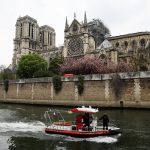PARIS, FRANCE - APRIL 16: A pompiers patrol boat is seen in front of the Notre-Dame Cathedral following a major fire yesterday on April 16, 2019 in Paris, France. A fire broke out on Monday afternoon and quickly spread across the building, causing the famous spire to collapse. The cause is unknown but officials have said it was possibly linked to ongoing renovation work. (Photo by Dan Kitwood/Getty Images)