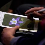 LITTLETON, COLORADO - APRIL 18: An attendee writes on the program at a remembrance service on April 18, 2019 in Littleton, Colorado. The service marks the 20th anniverssary of the 1999 massacre at Columbine High School where 12 students and a teacher were killed. (Photo by Rick Wilking-Pool/Getty Images)