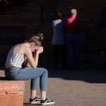 LITTLETON, COLORADO - APRIL 19: Maren Strother, 16, rests her head on her hands at the Columbine Memorial on April 19, 2019 in Littleton, Colorado.  April 20 will mark 20 years since the school shooting that claimed 13 lives at Columbine High School in Littleton, Colorado. (Photo by Joe Mahoney/Getty Images)