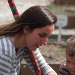 Katie Foerster and her son, Yannik, are planting fruits and vegetables in a garden this spring.