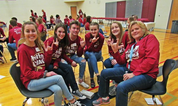 A group of students pose in their small group at Herriman High School’s “Be The Change” event...