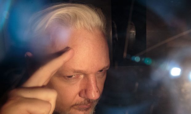LONDON, ENGLAND - MAY 01: Wikileaks Founder Julian Assange leaves Southwark Crown Court in a securi...