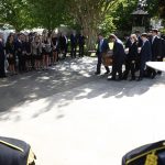 WAYNESVILLE, NC - MAY 05: Family, friends and a law enforcement honor guard look on as a casket carrying Riley Howell, a UNC Charlotte student, is taken into a service celebrating his life on May 5, 2019 in Waynesville, North Carolina. Riley Howell, an Army ROTC cadet who died last Tuesday when he tackled a gunman during a shooting at his school, was granted permission to receive military funeral honors for his heroism. (Photo by Brian Blanco/Getty Images)